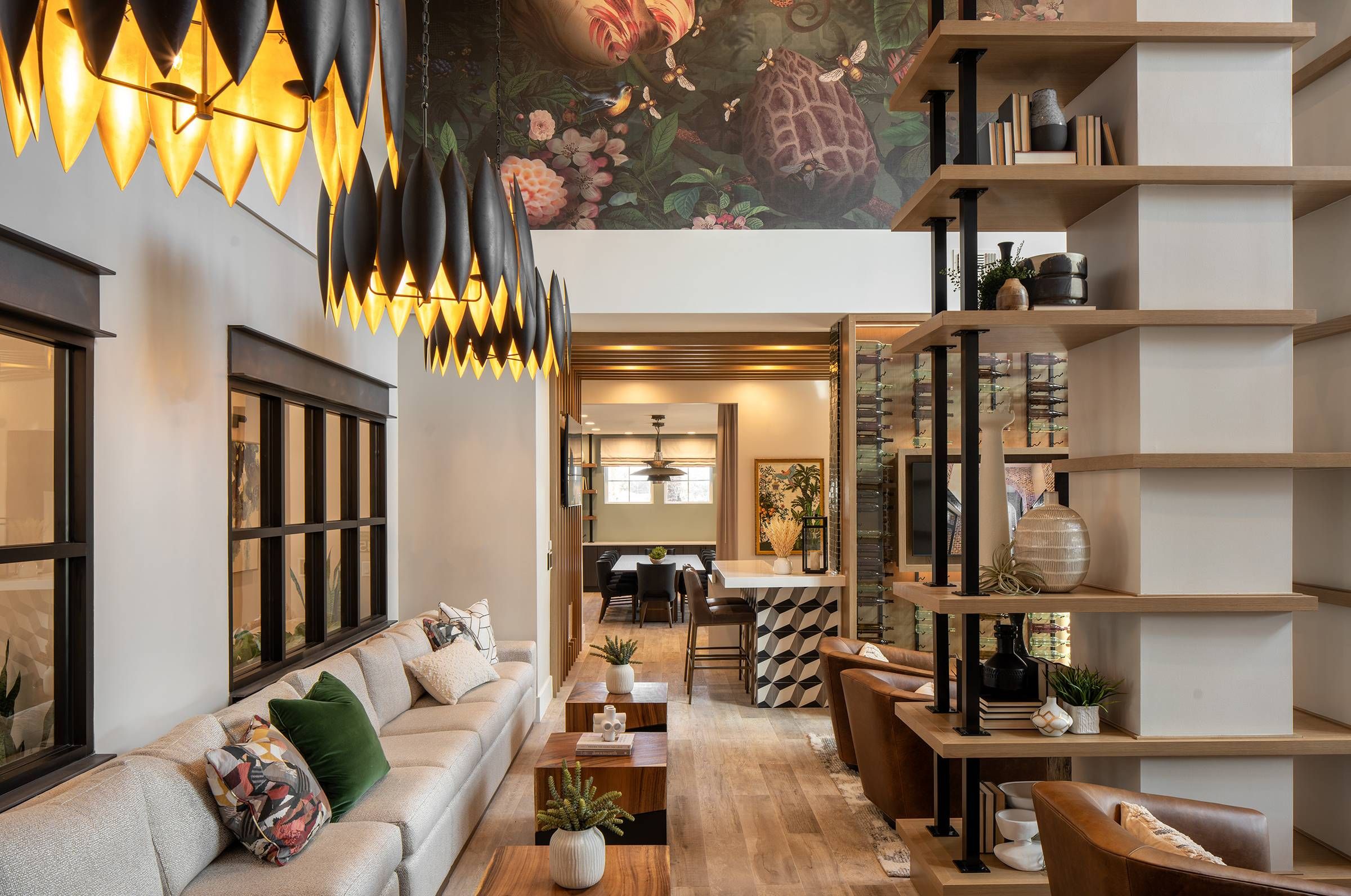 Vacant Landscape: A chic and stylish lounge at Alta Winter Garden with distinctive pendant lighting and an expansive mural, providing a warm communal space.