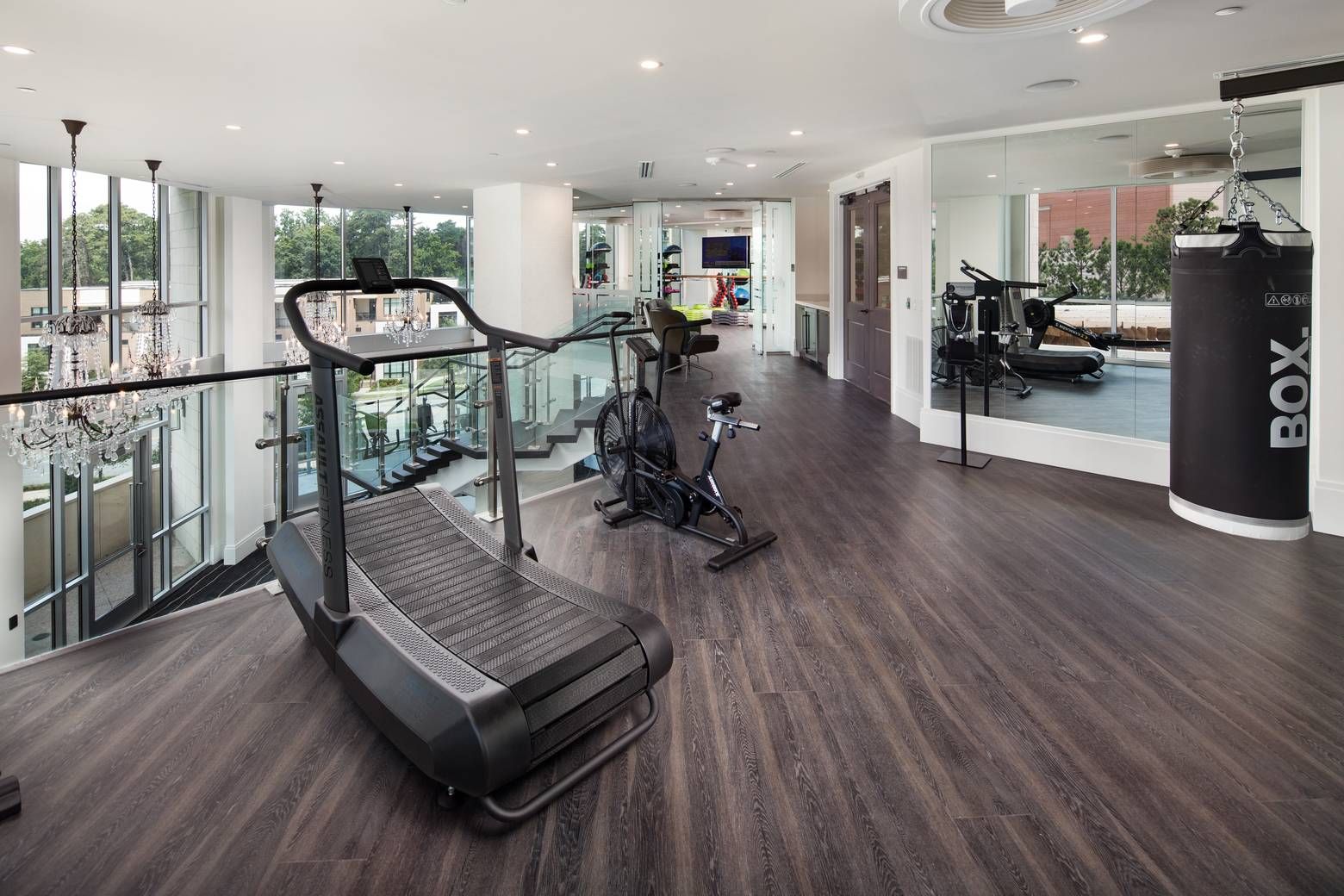 The Huntley fitness center top floor with various types of exercise equipment and mirrors.