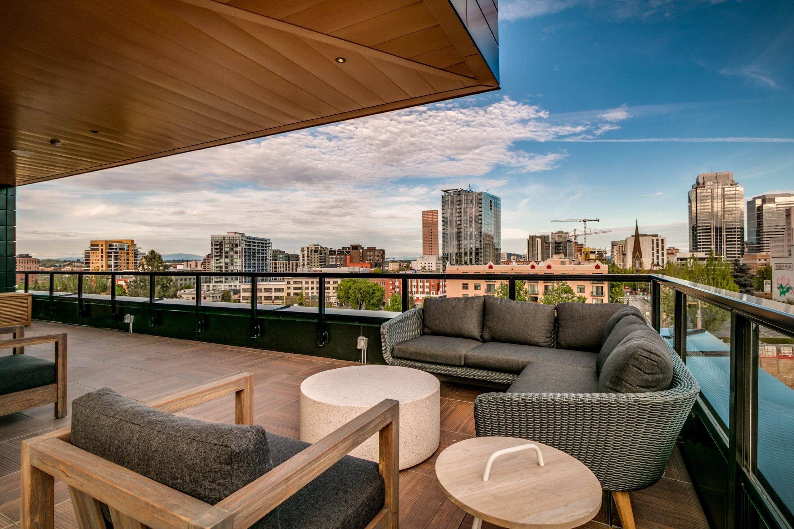 Alta Peak apartments outdoor amenity with skyline views and soft seating