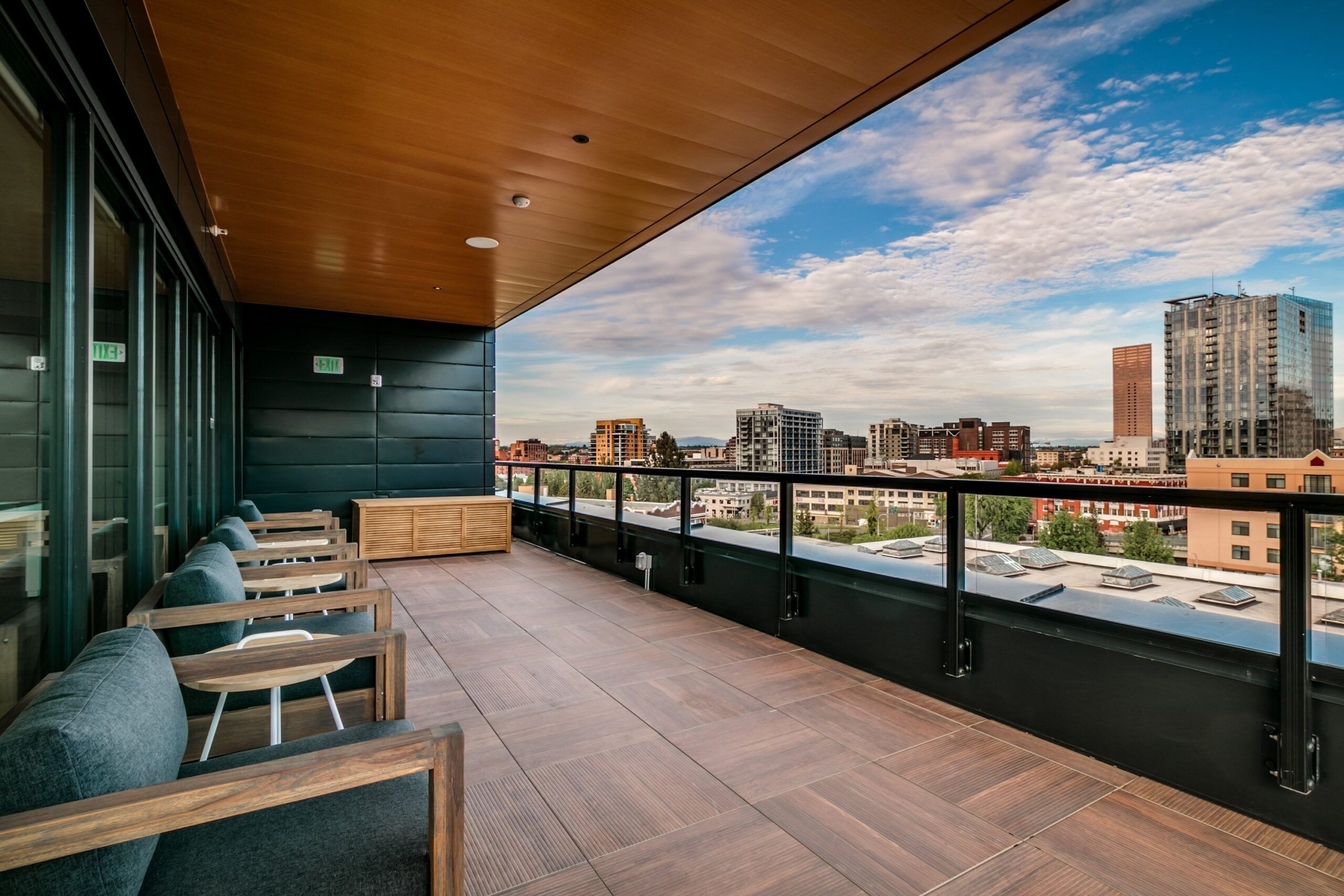 Alta Peak apartments outdoor amenity space with seating and skyline views