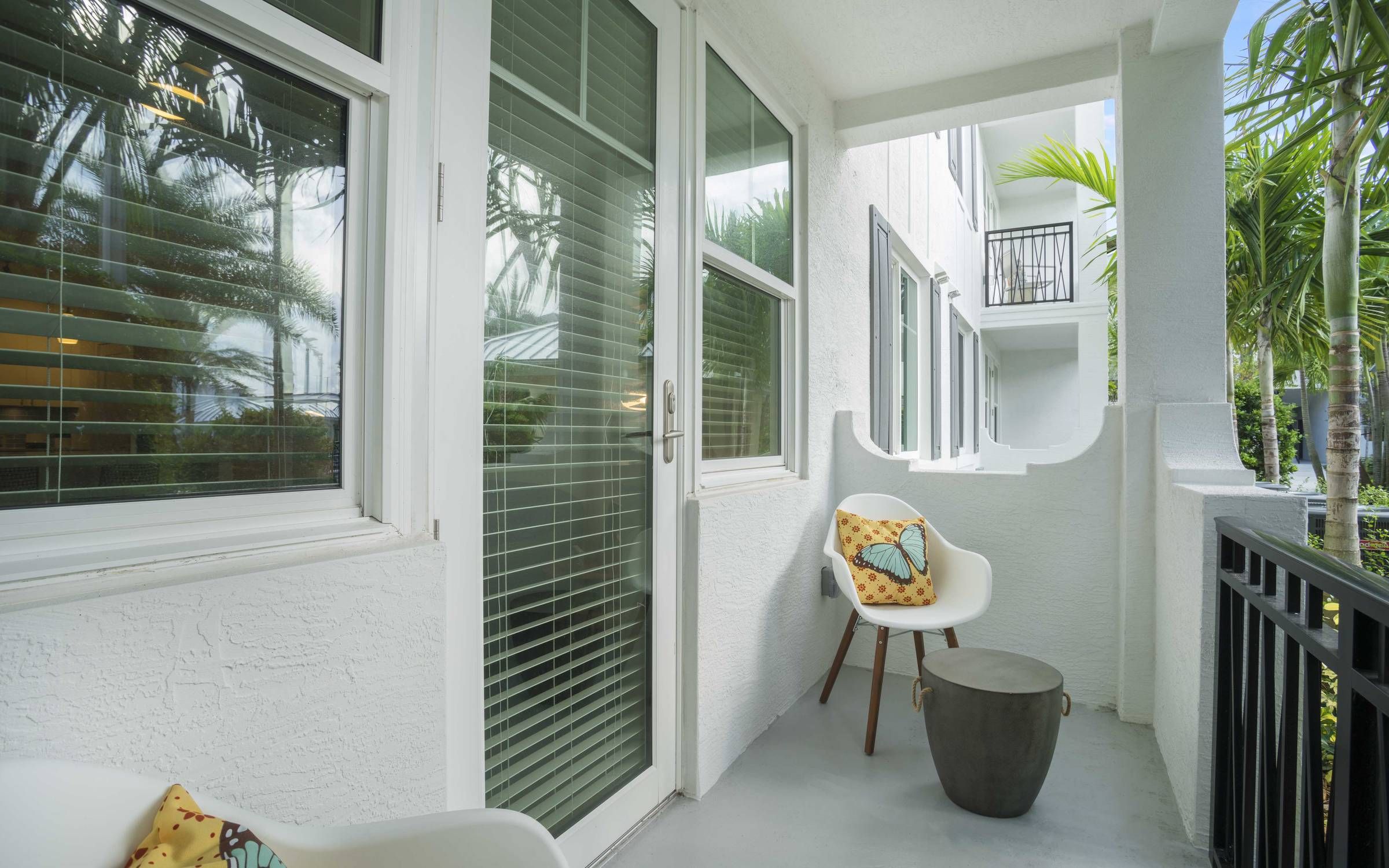 Delray Station private balcony with seating.