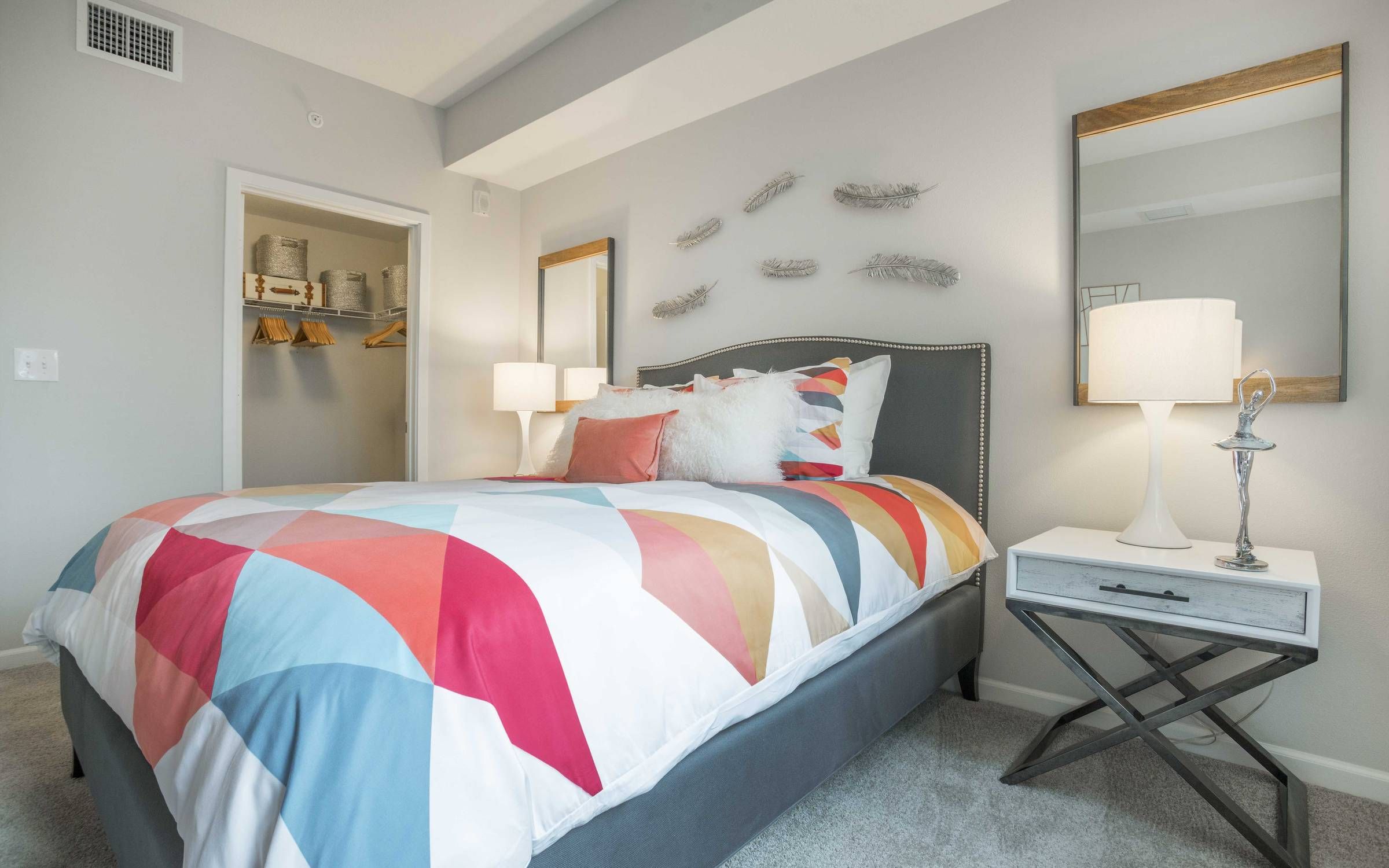 Delray Station bedroom with carpet and closet.