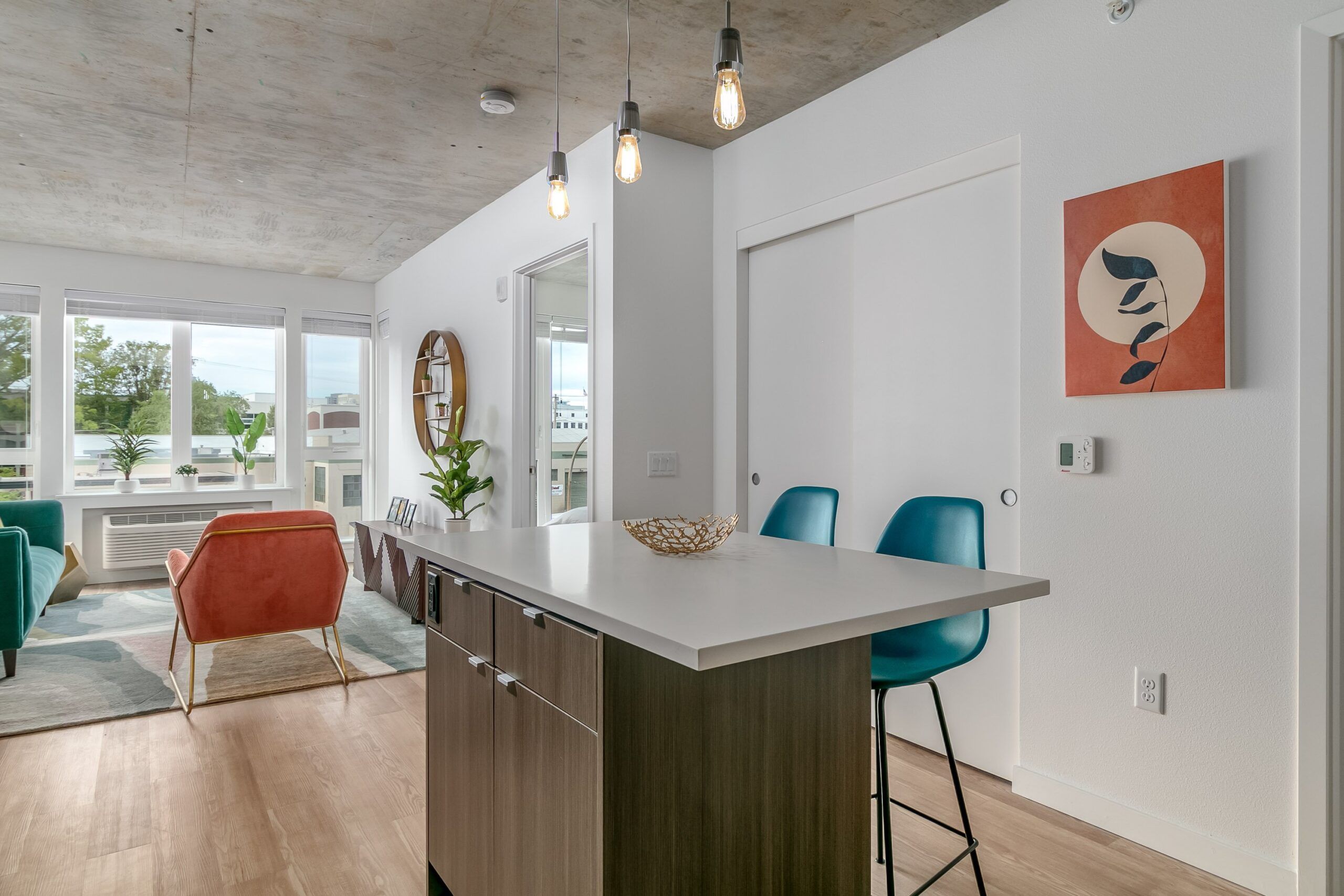 Alta Peak apartments interior showing kitchen island with bar stools