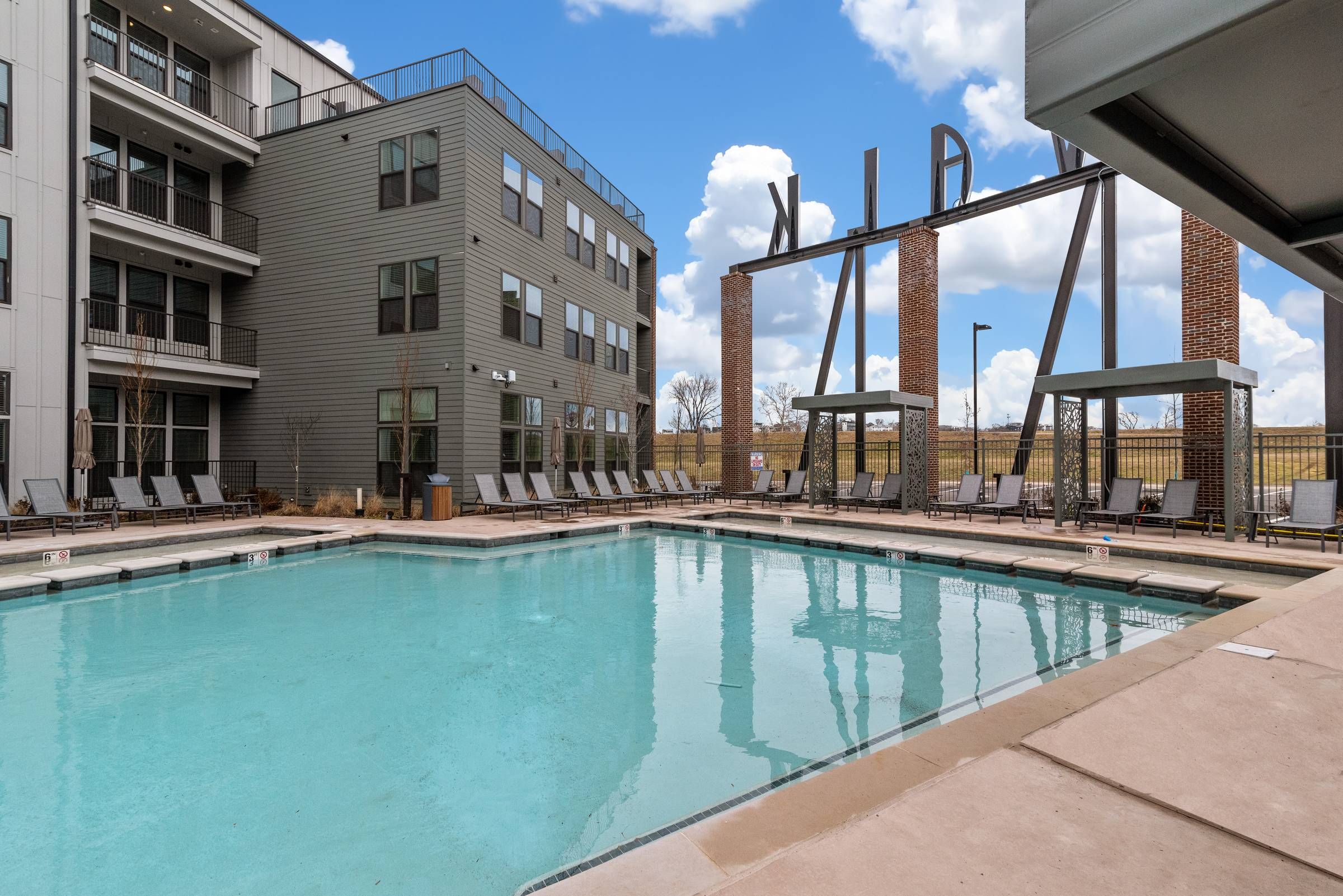 Alta Riverwalk pool with lounge chairs.