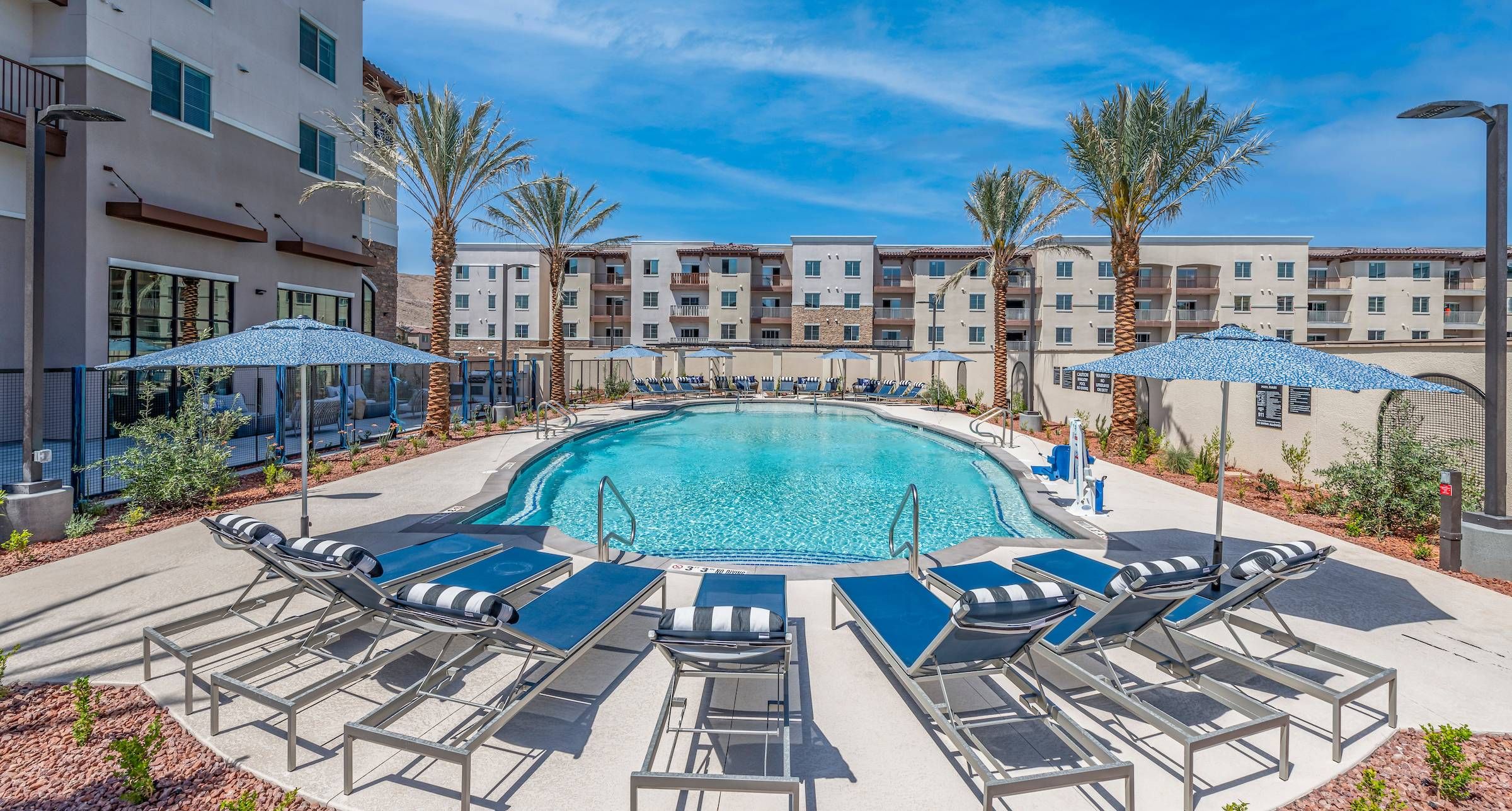 Large pool at Alta Southern Highlands with lounge chairs.