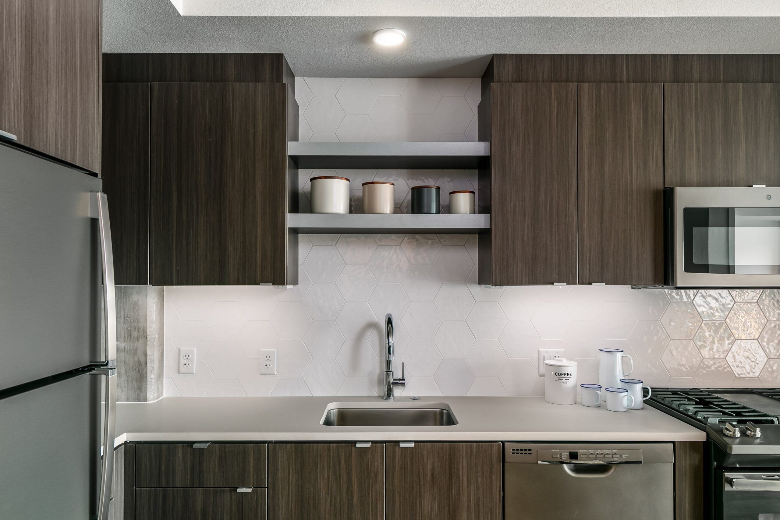 Alta Peak Apartments interior showing close up of wood kitchen cabinets