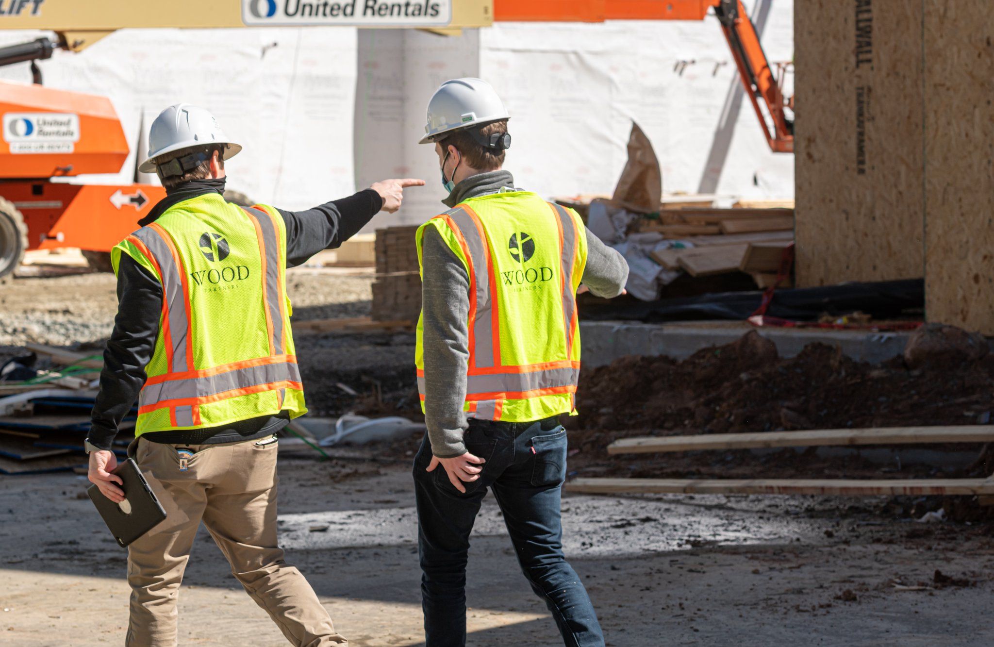 Wood Partners construction workers walking outside on construction site